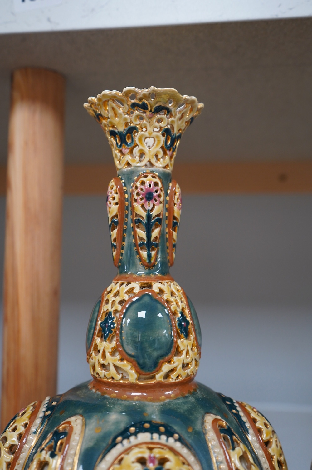 A pair of Zsolnay, Hungarian double walled reticulated vases, 29cm high. Condition - some restoration